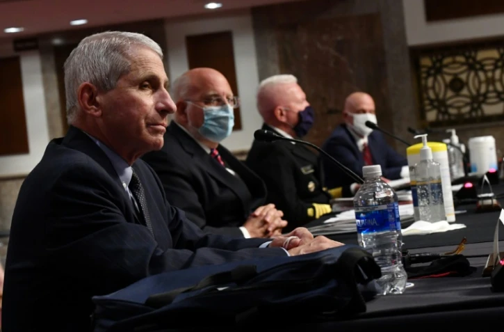 De gauche à droite, le Dr. Anthony Fauci, directeur de l'Institut national des allergies et des maladies infectieuses, Dr. Robert Redfield, directeur des CDC, et Brett Giroir, secrétaire adjoint la Santé et Stephen Hahn, patron de l'agence des médicaments FDA, lors d'une audition devant la commission sanitaire du Sénat américain le 30 juin 2020