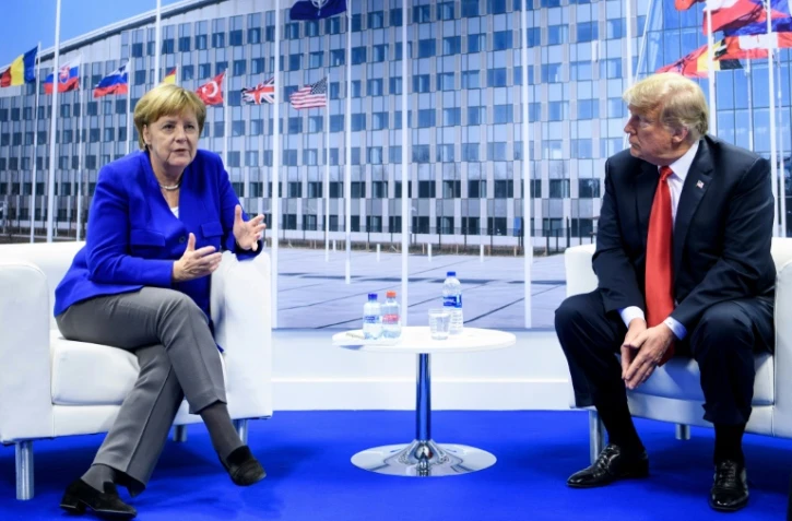 Angela Merkel et Donald Trump parlent à la presse à l'issue d'un entretien en tête-à-tête au premier jour du sommet de l'Otan à Bruxelles, le 11 juillet 2018