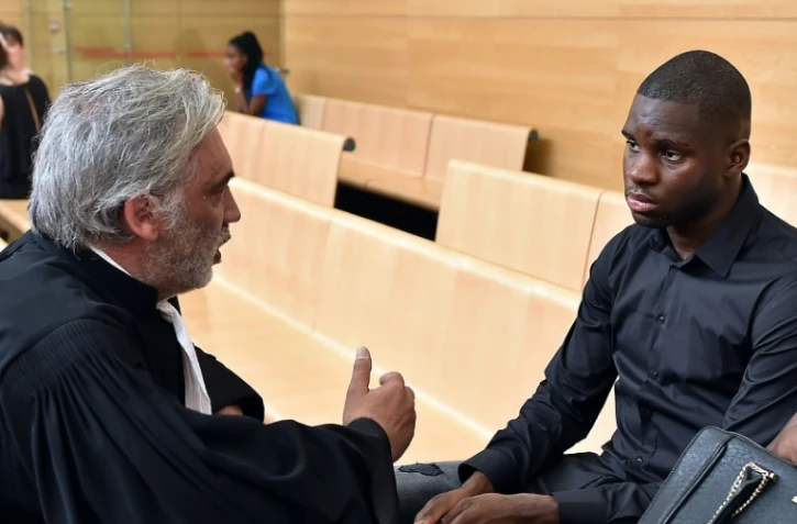 Odsonne Edouard avec son avocat Pierre Le bonjour avant une audition le 13 juin 2017 au Palais de justice de Toulouse