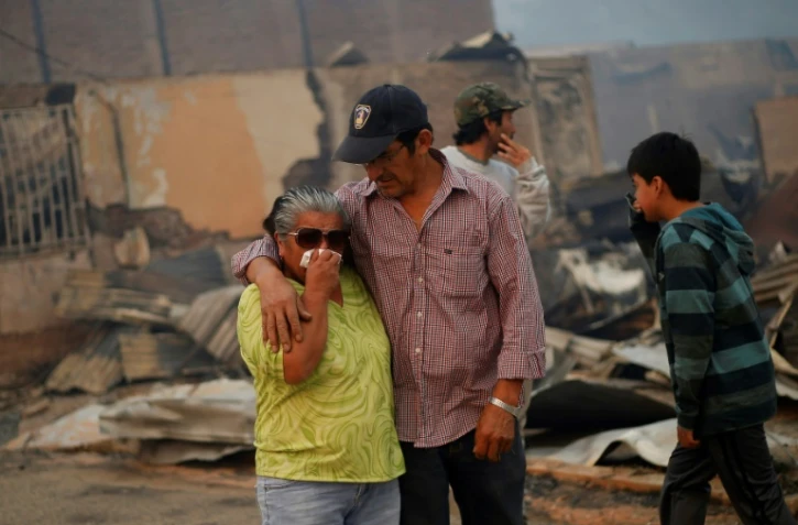 Détresse des Chiliens après l'incendie à Santa Olga, à 240 km au sud de Santiago, le 26 janvier 2017