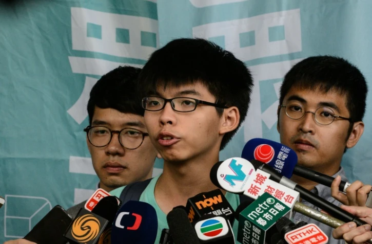 Joshua Wong, Nathan Law et Alex Chow, figures de la "révolte des parapluies", le 15 août 2016 à Hong-Kong