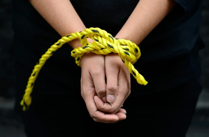 Des militants d'Amnesty International lors d'une manifestation contre la torture le 4 septembre 2014 à Mexico