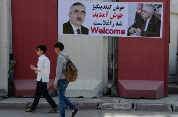 Affiche montrant l'image du général Abdul Rashid Dostum, chef de guerre et vice-président de retour d'exil, à Kaboul le 22 juillet 2018