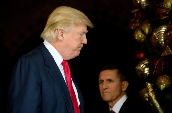 Le président américain Donald Trump (g) et son conseiller à la Sécurité nationale Michael Flynn, le 21 décembre 2016 à Palm Beach en Floride