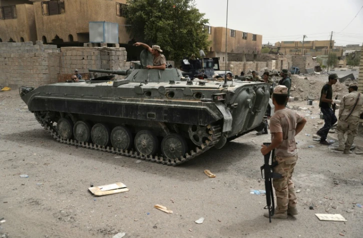 Les forces gouvernementales irakiennes patrouillent à Fallouja, le 18 juin 2016