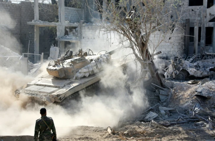 Les forces pro-gouvernementales syriennes progressent dans le district de Qaboun, à la périphérie de la capitale Damas, le 13 mai 2017