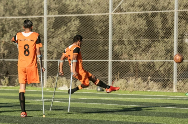 Photo de joueurs d'une équipe palestinienne de football rassemblant des personnes amputées, pour la plupart dans le cadre du conflit avec Israël, prise le 9 juillet 2018 à Deir al Balah, dans la bande de Gaza