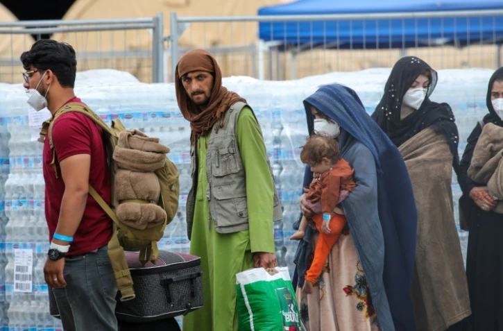 Des réfugiés afghans arrivant sur la base aérienne américaine de Ramstein, en Allemagne, le 26 août 2021