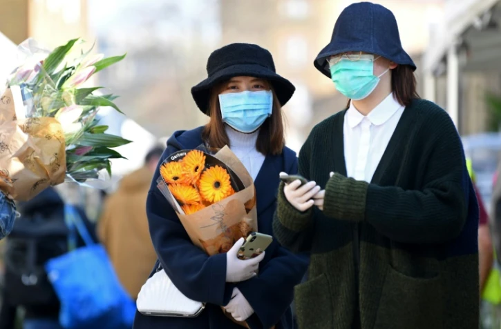 Dans les rues d'un marché à Londres, le 22 mars 2020