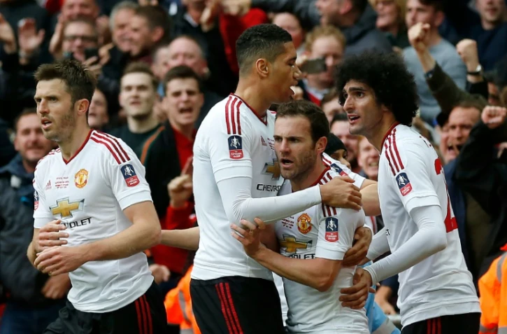 Les joueurs de Manchester United célèbrent le but de Juan Mata (c), le 21 mai à Londres, en finale de la FA Cup