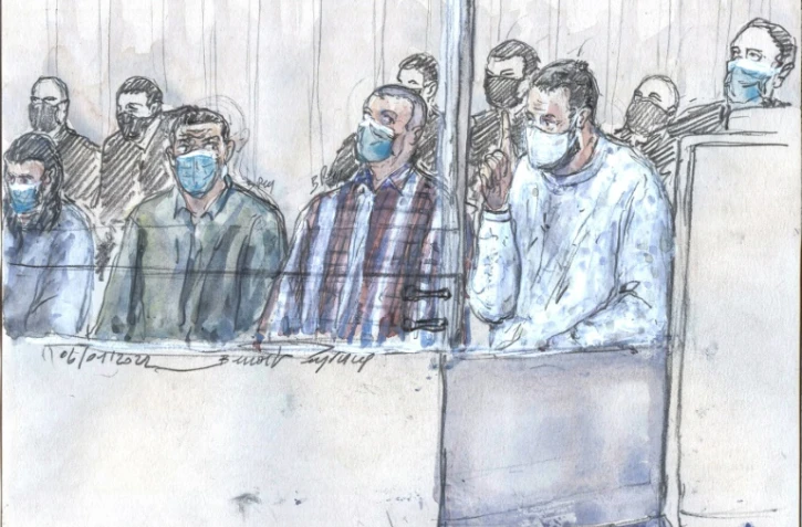 (g-d) Osama Krayem, Mohamed Abrini, Mohamed Amri et Salah Abdeslam à la cour d'assise spéciale de Paris lors du procès des attentats de 13-novembre 2015