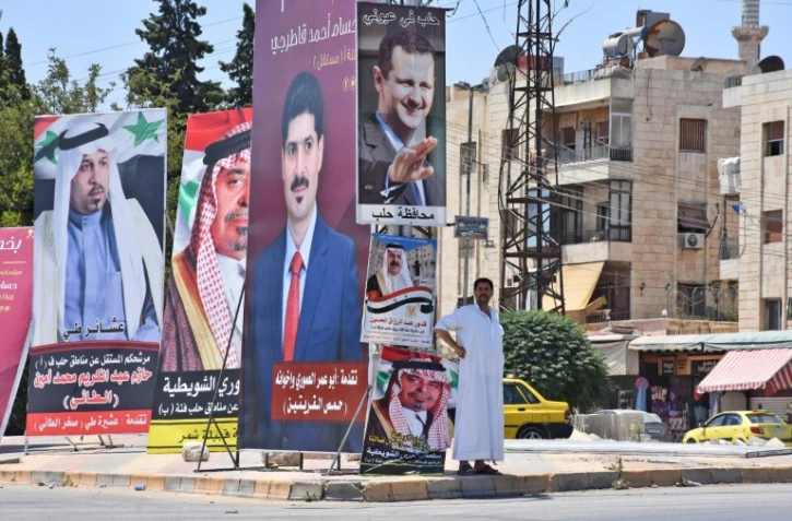 Des posters de candidats aux élections législatives à Alep (Syrie), le 15 juillet 2020