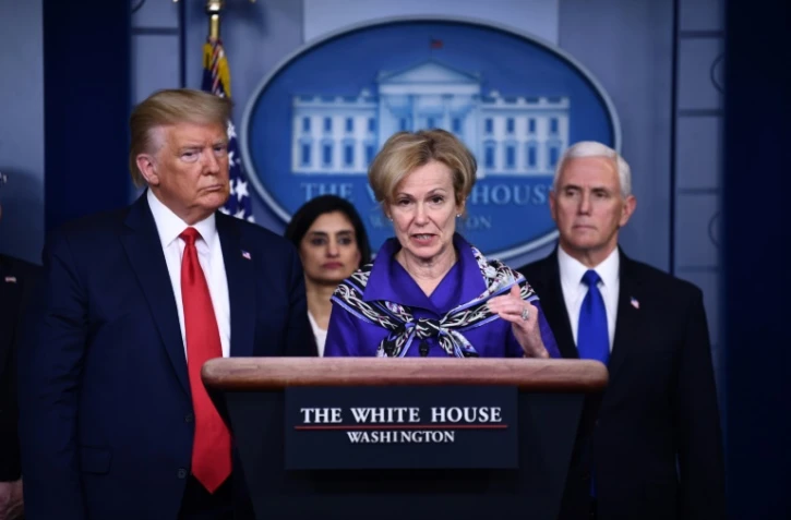 Le président américain Donald Trump et Deborah Birx, responsable de la coordination du dossier coronavirus à la Maison Blanche,le 18 mars 2020 à Washington lors d'un point sur la situation dans le pays