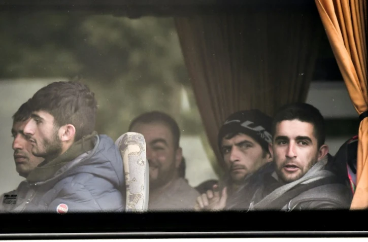 Des migrants évacués à bord d'un car jeudi 24 mai 2018 à Grande-Synthe