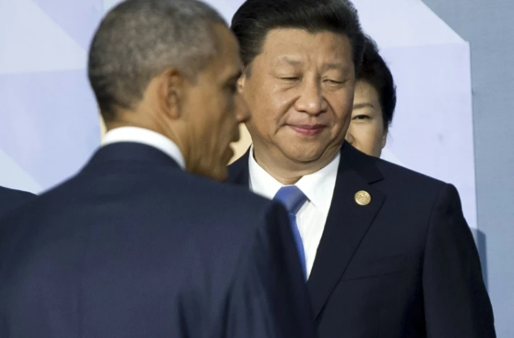 Le président américain Barack Obama (à gauche) et le président chinois Xi Jinping à Manille le 19 novembre 2015