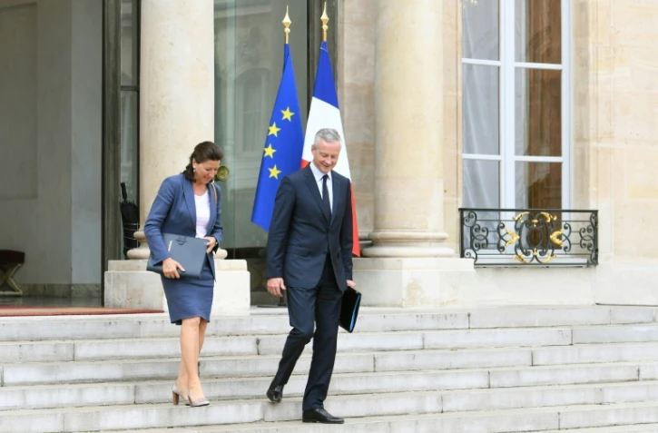 La ministre de la Santé Agnès Buzyn (G) et le ministre de l'Economie Bruno Le Maire, sortant de l'Elysée après un conseil des ministres, le 30 août 2017
