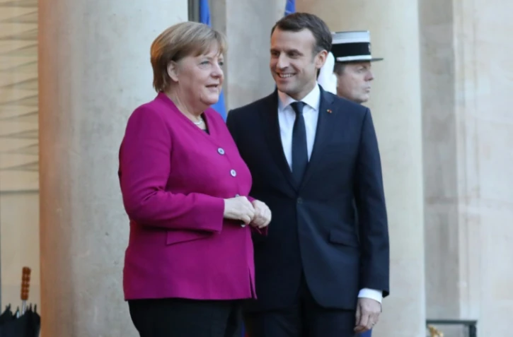 La chancelière allemande Angela Merkel et le président Emmanuel Macron à l'Elysée, le 19 janvier 2018 à Paris 