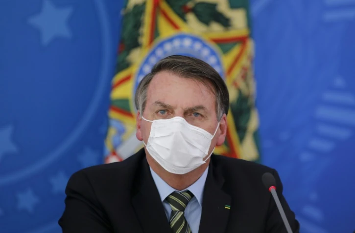 Le président brésilien Jair Bolsonaro tient une conférence de presse, le 18 mars 2020 au palais présidentiel à Brasilia