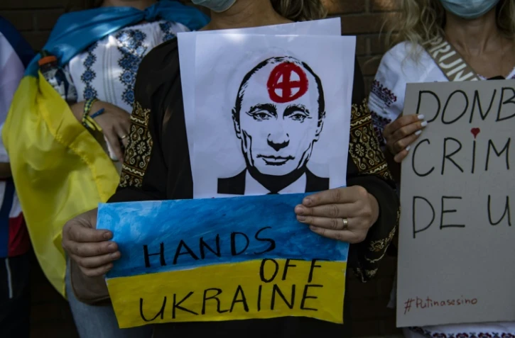 Ukrainian citizens take part in a protest in support of Ukraine in front of the Russian Embassy in Santiago, Chile, on February 26, 2022