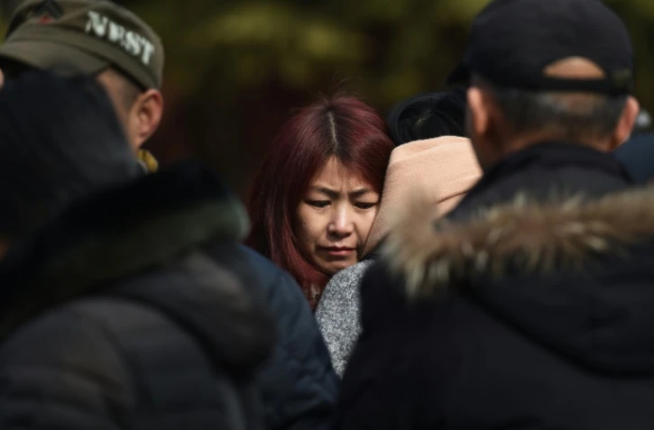 Des parents de passagers du vol MH370 de la Malaysia Airlines, disparu en vol, se retrouvent le 8 mars 2016 à Pékin pour le 2ème anniversaire de cette catastrophe aérienne qui reste un mystère