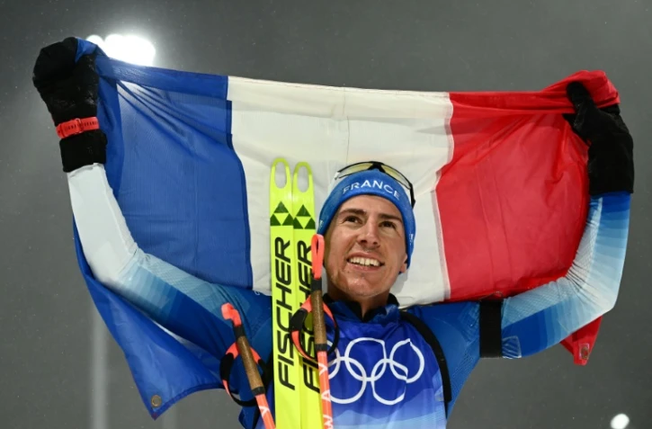Le biathlète Quentin Fillon Maillet après sa victoire lors de la poursuite des Jeux olympiques de Pékin, le 13 février 2022