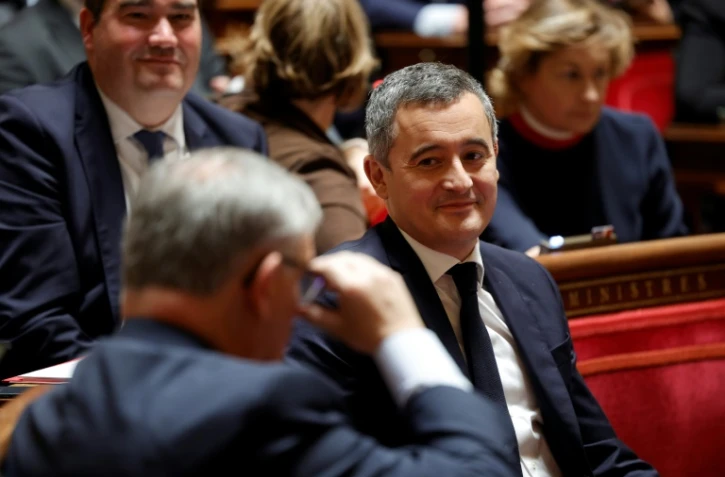 Le ministre de l'Intérieur Gérald Darmanin au Sénat à Paris après l'adoption du projet de loi immigration par les sénateurs, le 14 novembre 2023