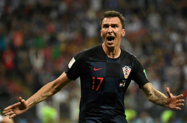 L'attaquant croate Mario Mandzukic exulte après avoir marqué le second but des siens contre l'Angleterre en prolongation de la demi-finale du Mondial, le 11 juillet 2018 à Moscou  