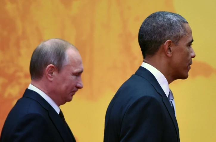 Le président russe Vladimir Poutine et le président américain Barack Obama au sommet de l'Apec, le 11 novembre 2014 au Lac Yanki, au nord de Pékin