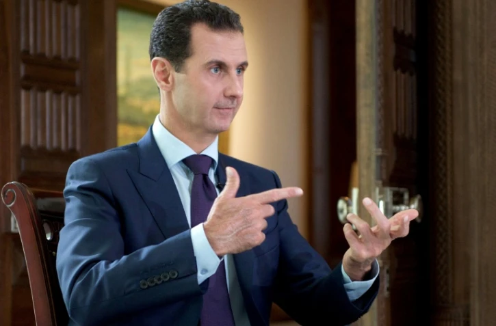 Photo du président syrien Bachar al-Assad pendant une interview à la chaîne danoise TV2, fournie par l'agence officielle syrienne Syrian Arab News Agency (SANA) le 6 octobre 2016