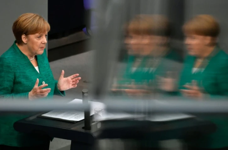 La chancelière allemande Angela Merkel prononce un discours au Bundestag, le 28 juin 2018 à Berlin