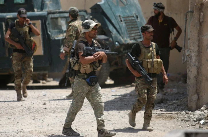 Des membres des forces gouvernementales irakiennes, le 26 juin 2016 à Fallouja