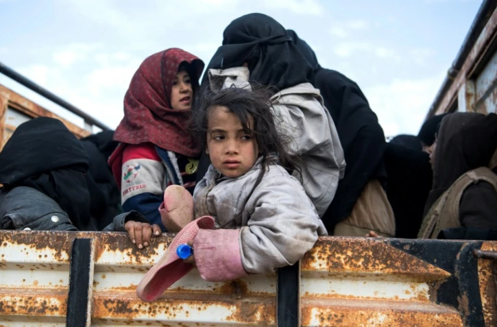 Des civils fuyant les zones de combats près de Baghouz, dans l'est de la Syrie, le 14 février 2019