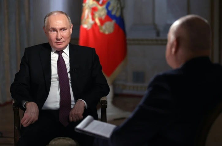 Le président russe Vladimir Poutine lors d'une interview avec le directeur de l'agence d'information russe RIA Novosti, au Kremlin, le 12 mars 2024 à Moscou