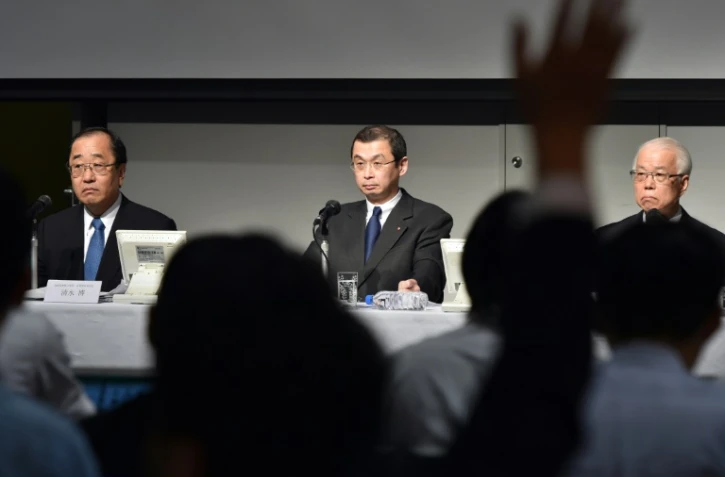Le directeur général de Takata, Shigehisa Takada (c) lors d'une conférence de presse à Tokyo, le 25 juin 2015