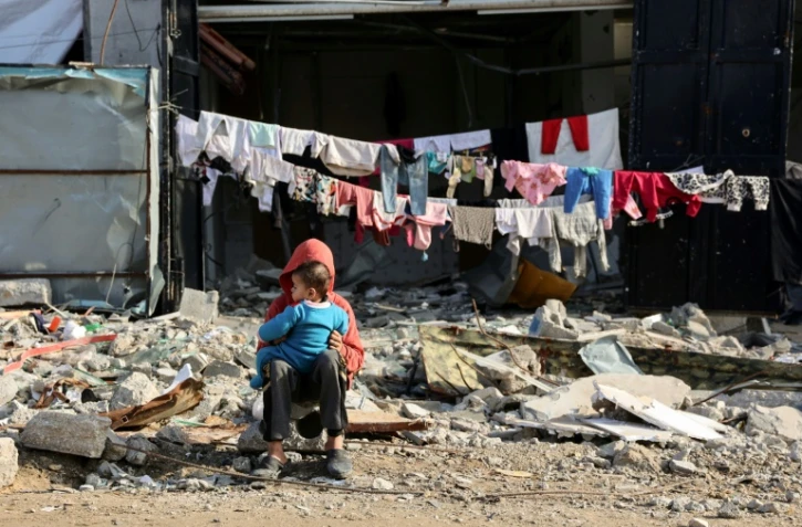 Des enfants palestiniens dans le quartier Shujaiya de la ville de Gaza, le 4 janvier 2025