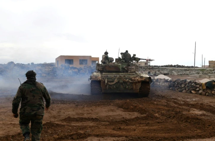 Des soldats syriens rassemblés à Ubayd avant leur progression vers l'aéroport militaire de la province d'Alep, le 18 janvier 2018