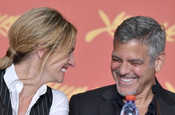 Les acteurs américains Julia Roberts et George Clooney au festival de Cannes lors de la présentation du film "Money Monster", le 12 mai 2016