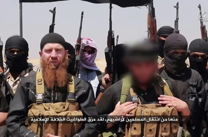 Image fournie par le média jihadiste al-Itisam Media le 29 juin 2014, censé montrer des membres du groupe Etat islamique dans un lieu non défini entre la province irakienne de Ninive en Irak et la ville syrienne de Al-Hasakah