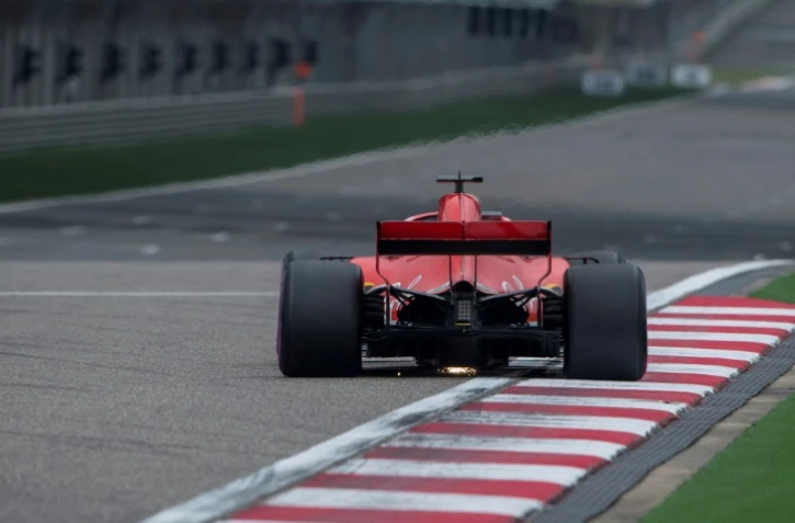 L'Allemand Sebastian Vettel au volant de sa Ferrari, lors des qualifications pour le GP de Chine, sur le circuit de Shanghai, le 14 avril 2018