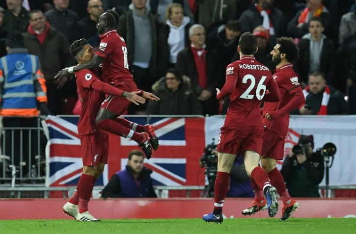 Roberto Firmino (g) auteur d'un triplé pour Liverpool lors de la victoire face à Arsenal 5-1 le 29 décembre 2018