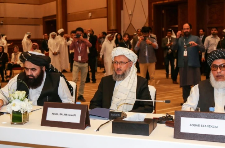 Des responsables afghans et des talibans réunis à Doha, capitale du Qatar le 7 juillet 2019 pour discuter de l'avenir du pays en guerre