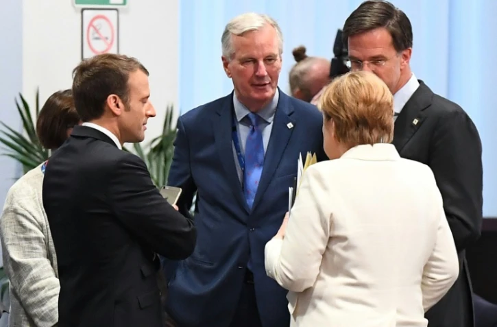 Le président Emmanuel Macron, le négociateur du Brexit Michel Barnier, la chancelière allemande Angela Merkel et le Premier ministre néerlandais Mark Rutte à Bruxelles le 20 octobre 2017
