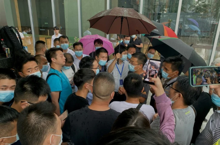Rassemblement de propriétaires spoliés devant le siège du groupe immobilier Evergrande à Pékin, le 14 septembre 2021