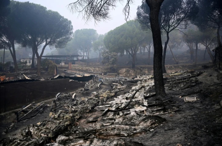 Des bateaux fondus sont visibles au barrage de San Juan après qu'un incendie de forêt a ravagé la région, à 65 kilomètres au sud-ouest de Madrid, le 28 juillet 2026