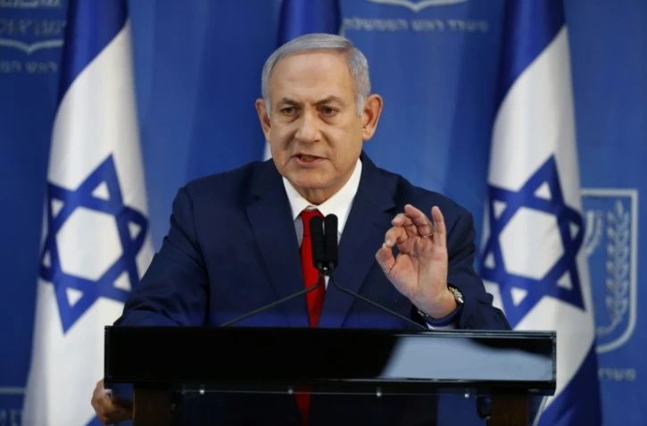 Le Premier ministre israélien Benjamin Netanyahu, confronté à une crise politique, s'exprime à Tel-Aviv lors d'une déclaration télévisée et devant la presse, le 18 novembre 2018