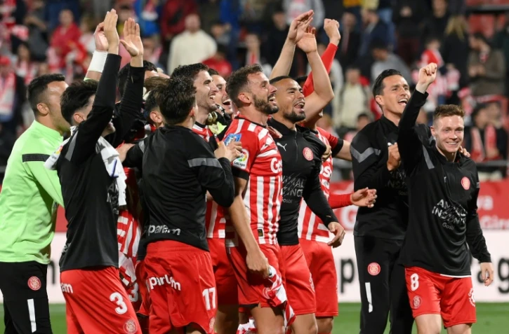 Les joueurs de Gérone célèbrent leur victoire 4-2 contre le Real Madrid mardi en championnat d'Espagne, à domicile au stade Montilivi.
