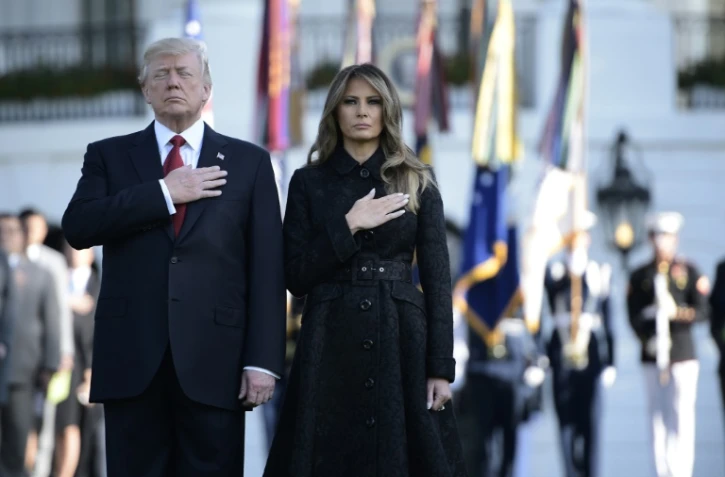 Le président américain Donald Trump (g) et son épouse Melania, le 11 septembre 2017 à la Maison Blanche, lors d'une cérémonie marquant le seizième anniversaire des attentats du 11 septembre 2001