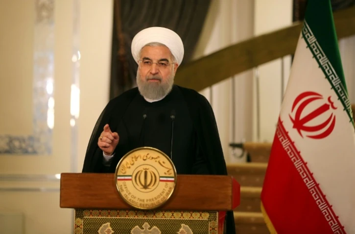 Une photographie, fournie par les services de la présidence iranienne, et montrant le président Hassan Rohani, réagissant le 13 octobre 2017 lors d'un discours à la télévision à un discours de Donald Trump