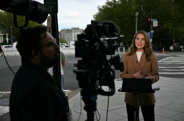 Une journaliste de CNN en duplex près de la Maison Blanche, à Washington, le 19 septembre 2026