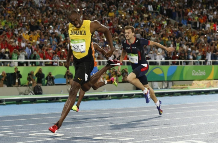 Le Jamaïcain Usain Bolt vainqueur du 200 m et le Français Christophe Lemaitre, 3e, lors des JO de Rio le 18 août 2016